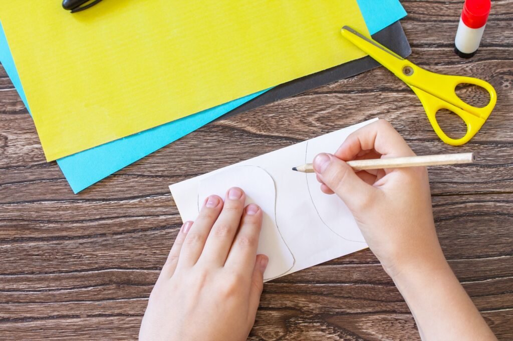 Mother's day greeting card gift - bee with spring apple tree flowers on a wooden table.